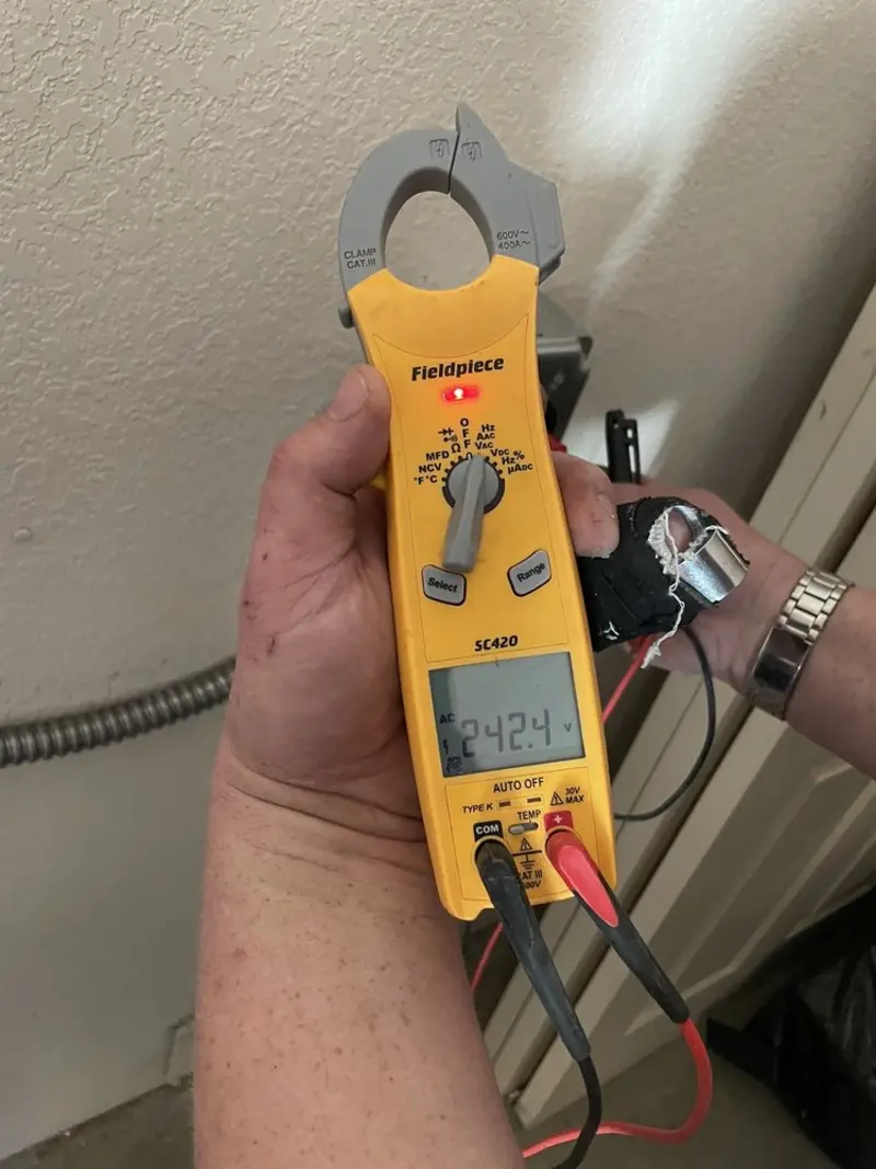 Voltage testing with clamp meter during Ceiling Fan Installation in Halfmoon